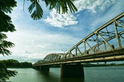 Explore bridge in Hue during the day and night when it shines bright in different colors