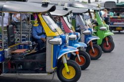 Tuk tuk cars lining up on Bangkok streets - Highlights of Thailand tour
