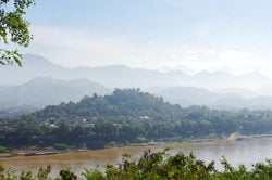 View of Luang Prabang over the Mekong river - Laos family adventure with Hanoi Voyages