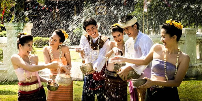 Thai family spashing each other for luck in Songkran
