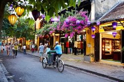 Hop on a cyclo in Hoi An - Vietnam Nature Tour with Hanoi Voyages