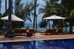 Pool with loungers and ocean view at Phu Quoc resort Cassia Cottage