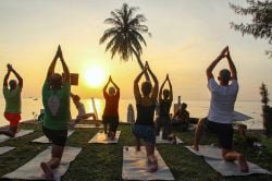 People practicing yoga at Phu Quoc Cassia Cottage Resort