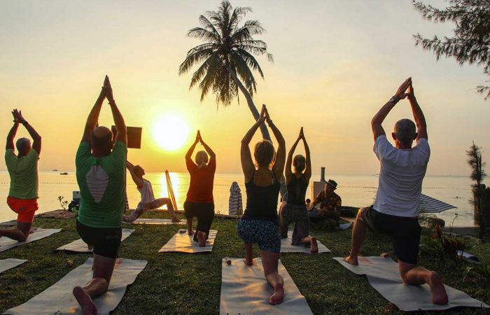 People practicing yoga at Phu Quoc Cassia Cottage Resort