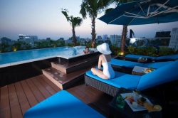 Alagon City Hotel Pool With a Guest on a Sunbed