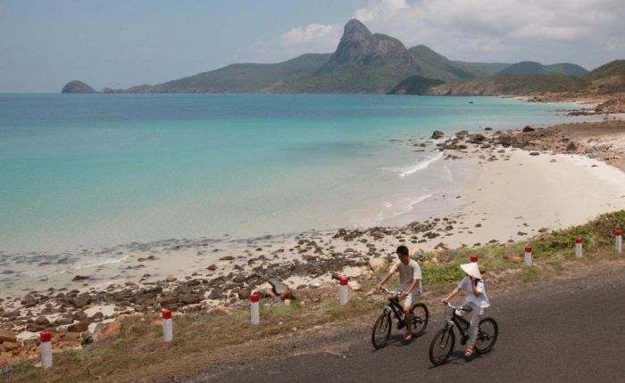 Cycling on the beautiful beach of Con Dao
