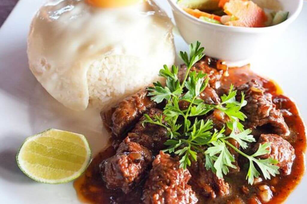 Cambodian Beef lok lak: rice, beef and pepper sauce.